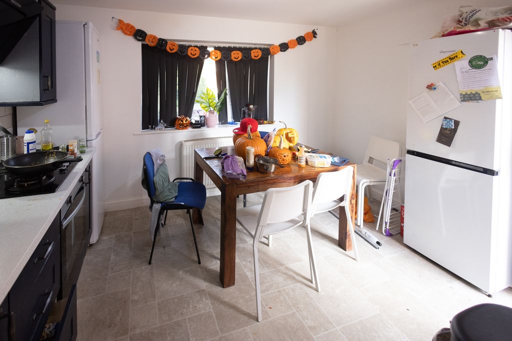 Property photo 2 of 6 A Functional Kitchen Area With A Wooden Dining Tab...