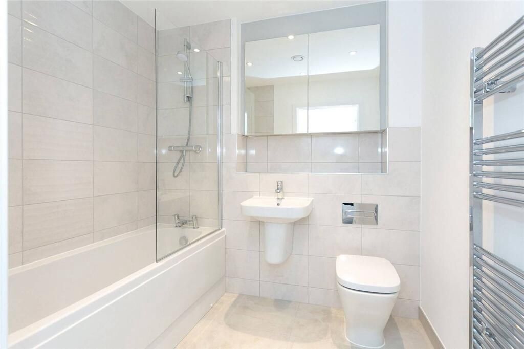 Property photo 2 of 8 Modern Bathroom With Full Tub And Stylish Tiling...