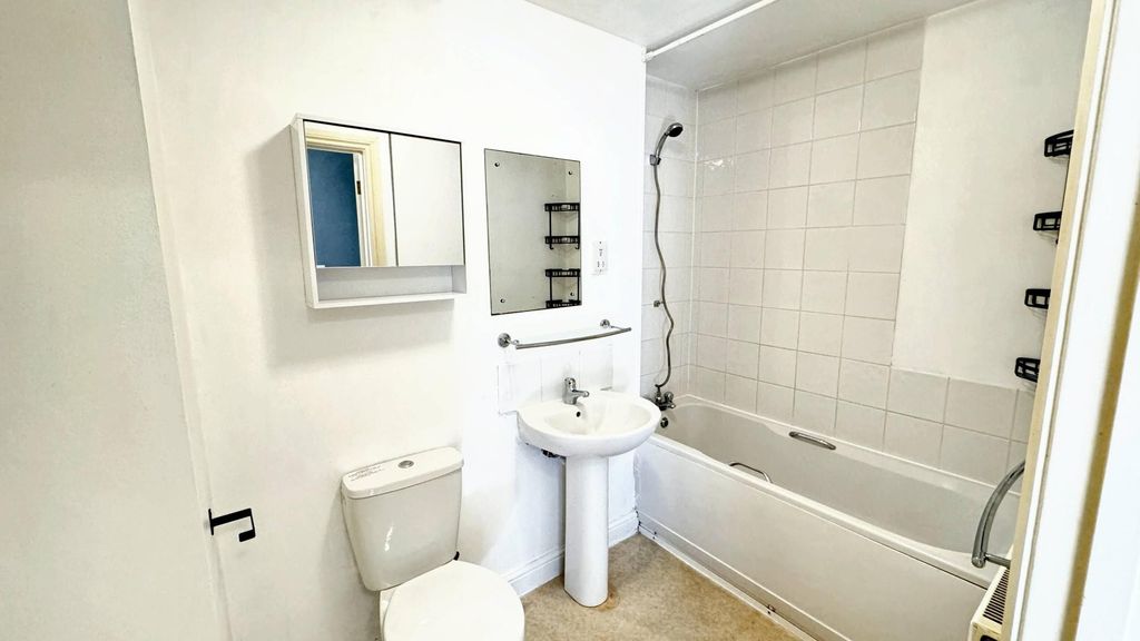 Property photo 3 of 9 Bright Bathroom With Full Tub And Mirror Cabinet...