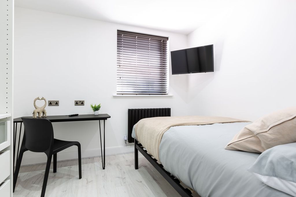 Property photo 3 of 5 A Bright, Minimalist Master Bedroom Featuring A La...