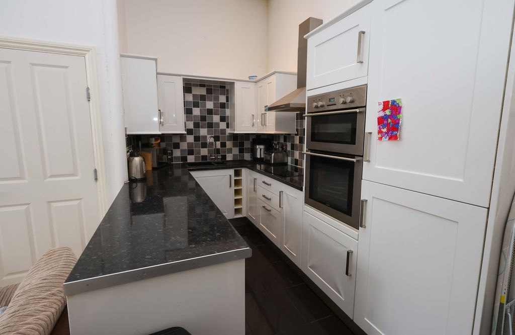 Property photo 3 of 7 Kitchen Area