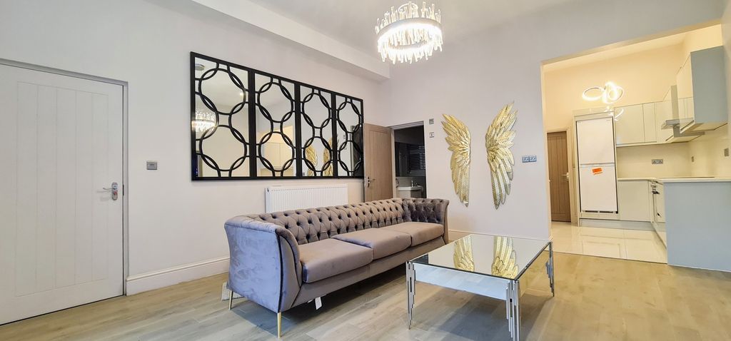 Property photo 3 of 10 A Spacious And Well-Maintained Living Room Featuri...