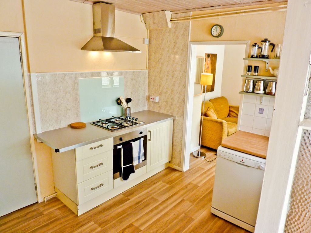 Property photo 1 of 5 Bright And Functional Kitchen Featuring Modern App...
