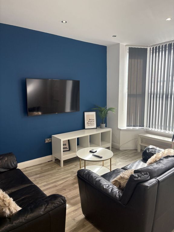 Property photo 1 of 28 Bright Contemporary Living Room With A Feature Blu...