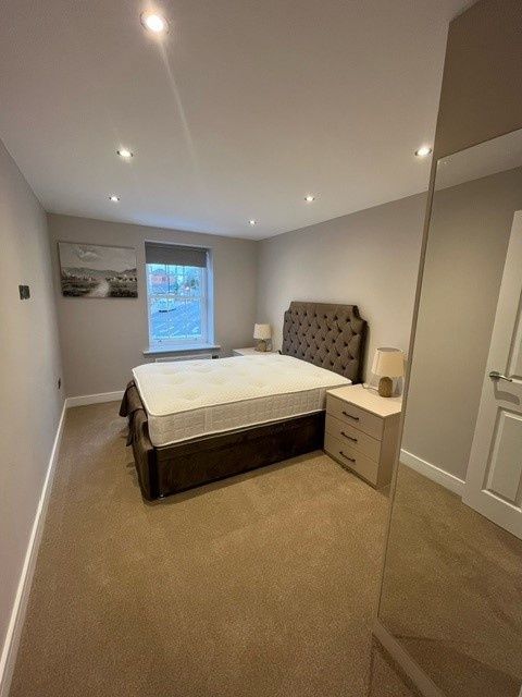 Property photo 2 of 10 A Modern And Inviting Master Bedroom With A Large ...