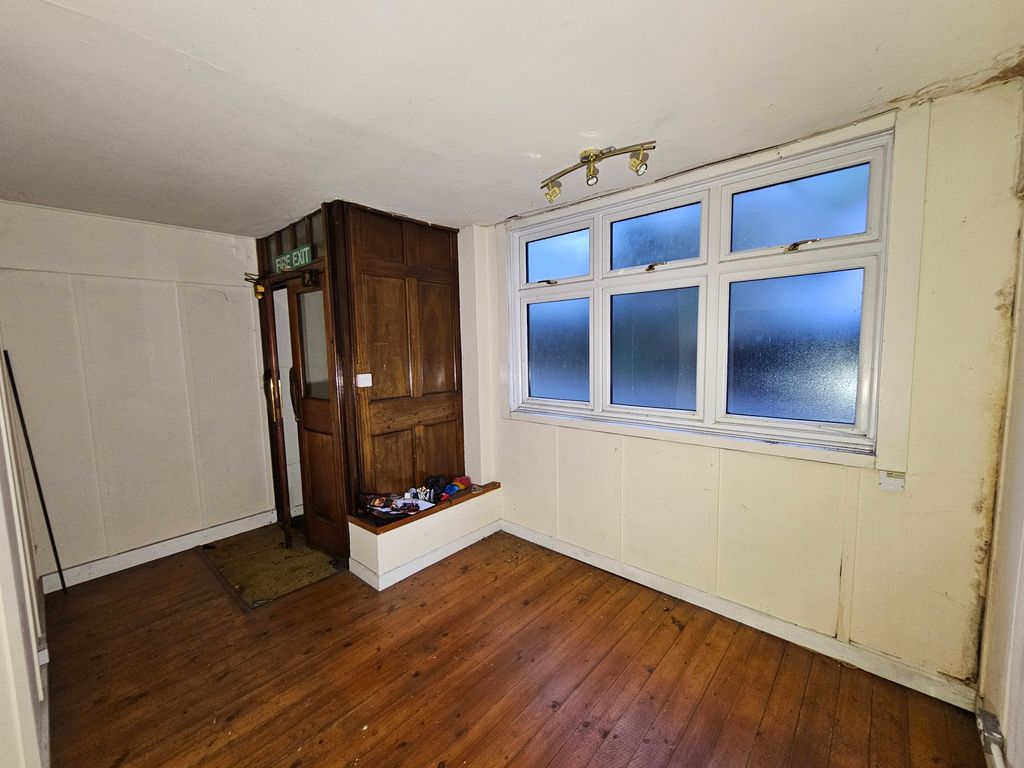 Property photo 2 of 11 Front Door And Front Window