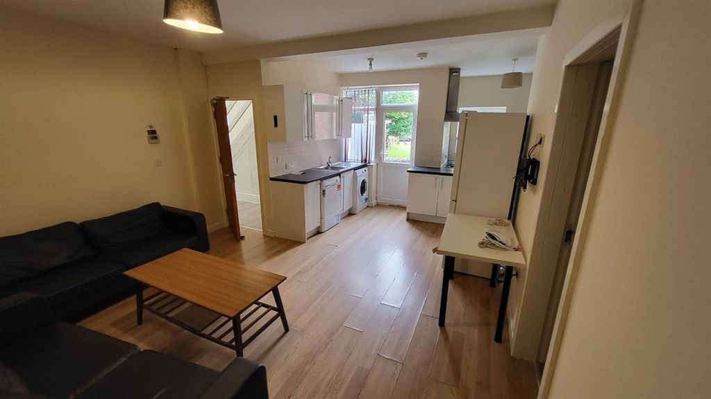 Property photo 1 of 14 A Spacious And Well-Lit Living Room With Modern Fu...