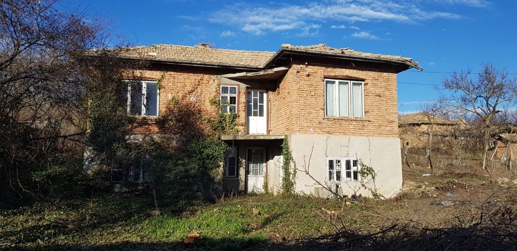 Property photo 1 of 49 Front View Of A Two-Storey Rural Bulgarian House Made Of Brick And Stone With A Tiled Roof And Surrounding Trees.