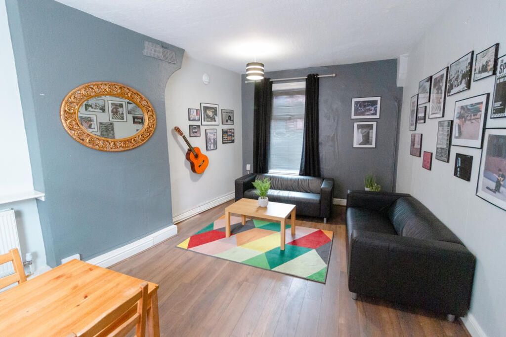 Property photo 1 of 3 This Inviting Living Room Features Stylish Furnish...