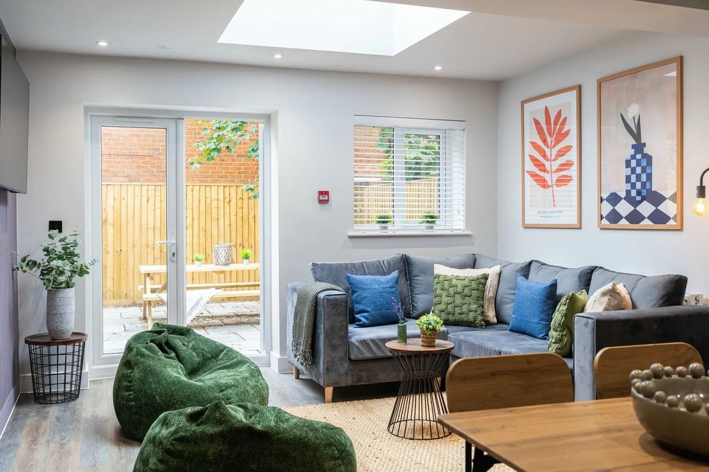 Property photo 2 of 25 A Bright And Welcoming Living Room Featuring A Lar...