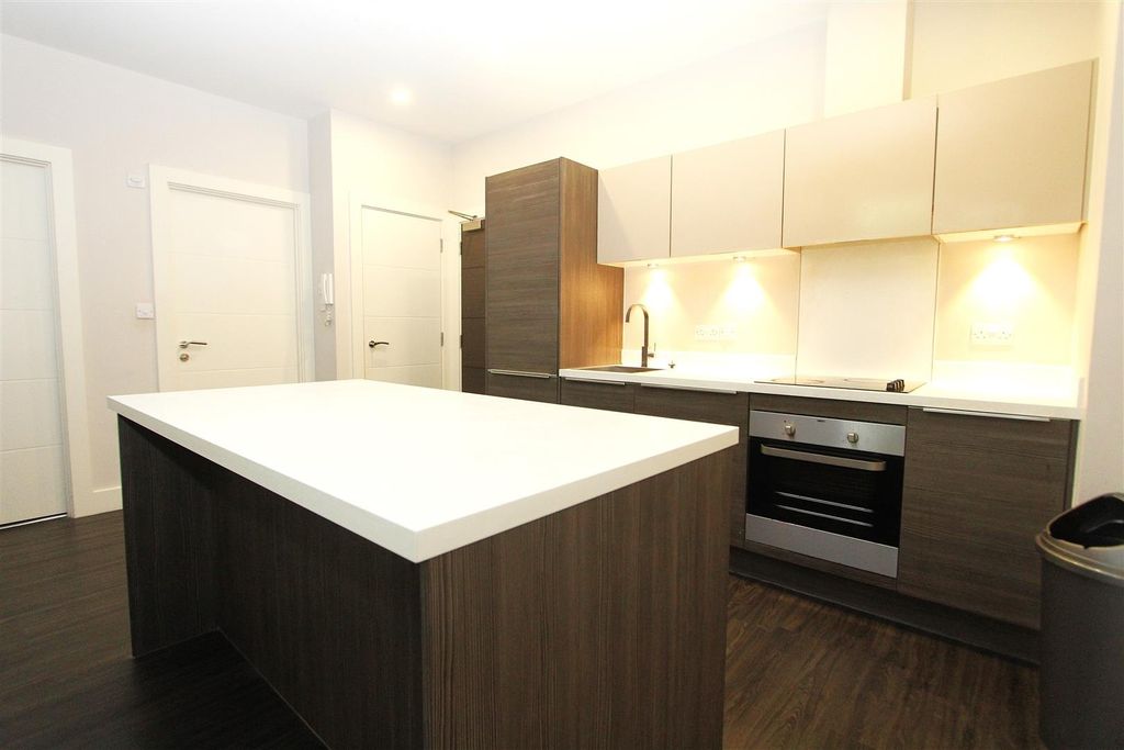 Property photo 2 of 11 Modern Kitchen With Sleek Island And Spot Lights...
