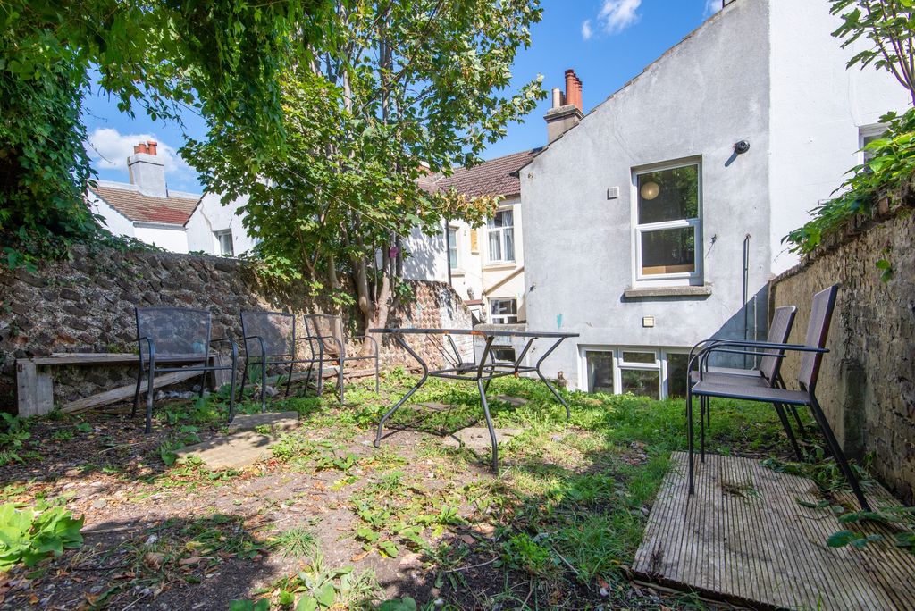 Property photo 2 of 20 A Charming Outdoor Garden Area Featuring Mature Tr...