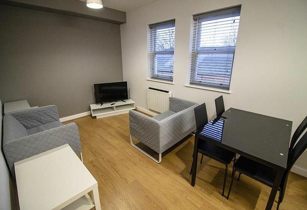 Property photo 2 of 6 Spacious And Inviting Living Room Featuring Modern...
