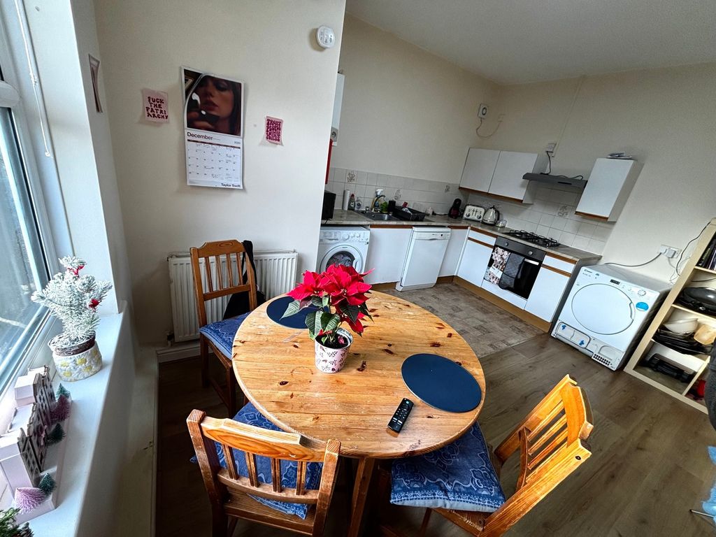 Property photo 1 of 8 Bright Open Kitchen-Diner With A Round Wooden Tabl...