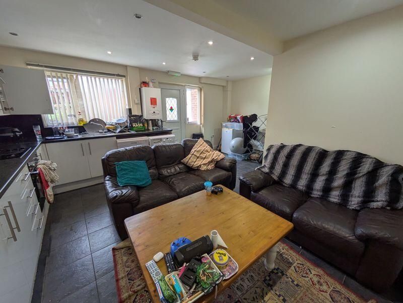 Property photo 1 of 9 A Bright And Inviting Living Room Featuring Comfor...