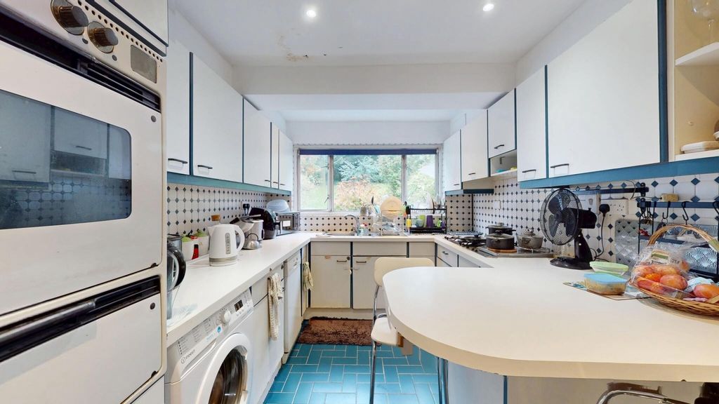 Property photo 3 of 12 Bright And Modern Kitchen Featuring Ample Natural ...