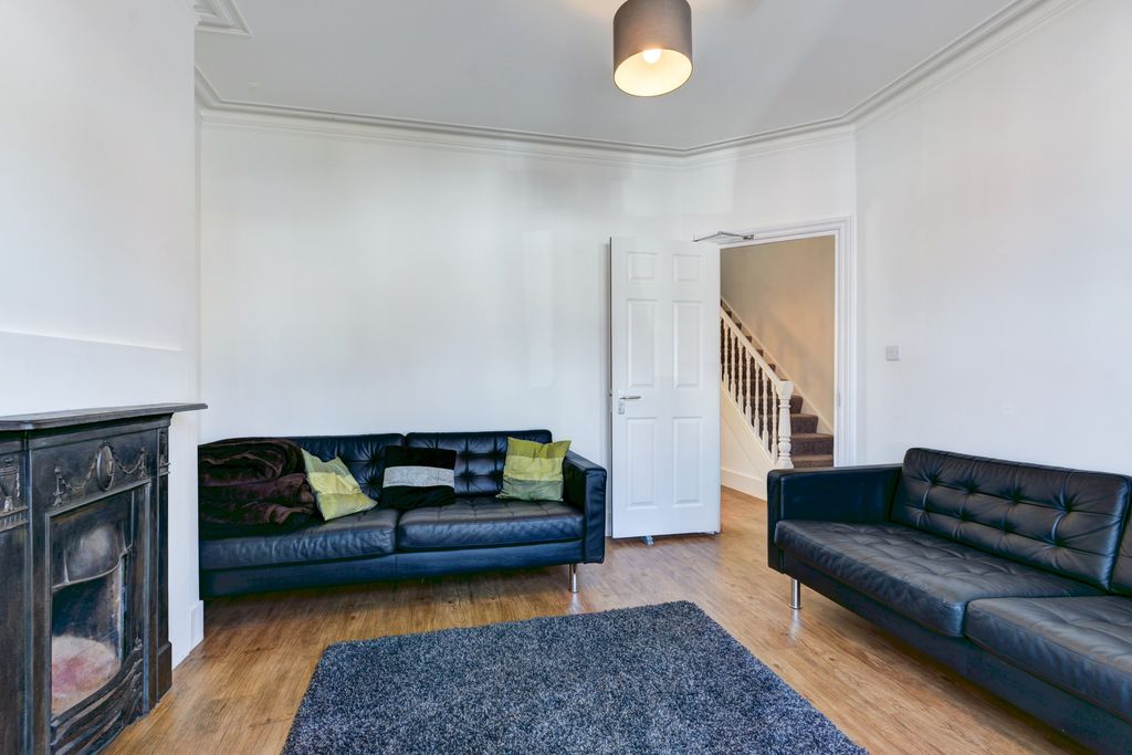 Property photo 1 of 12 A Modern And Spacious Living Room Featuring Two St...