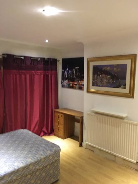 Property photo 3 of 20 Bright, Simply Furnished Bedroom With Wooden Floor...