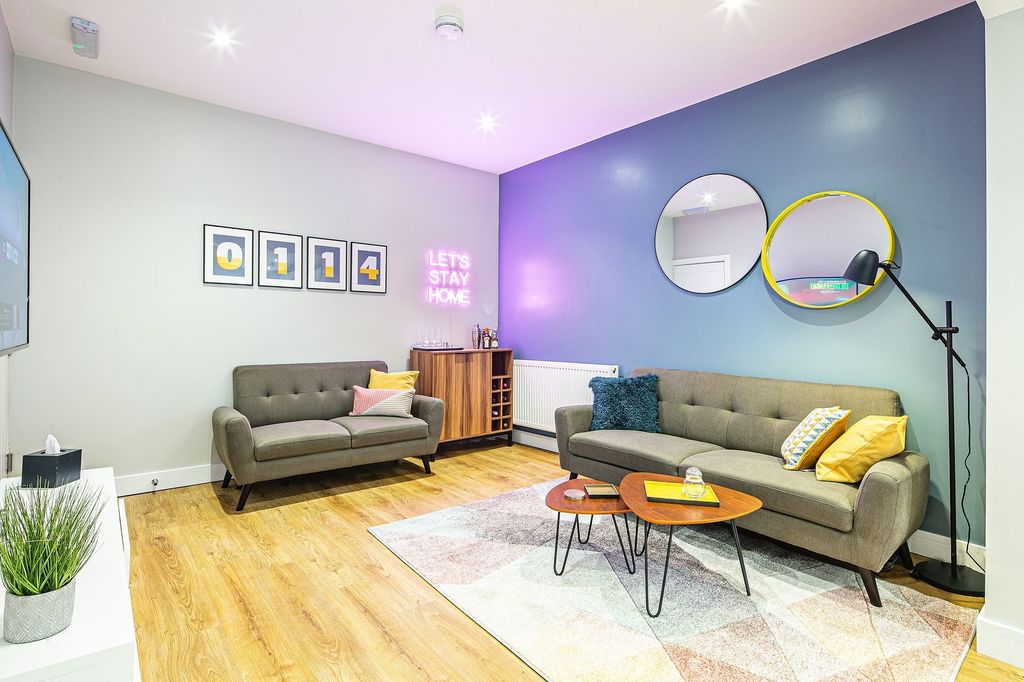 Property photo 2 of 23 Bright And Stylish Living Room Featuring Modern De...