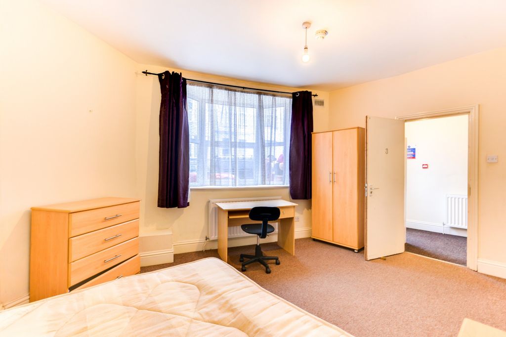 Property photo 2 of 19 A Bright And Welcoming Bedroom Featuring A Large W...