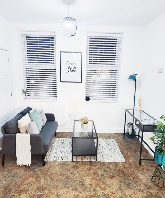 Property photo 1 of 26 Bright, Modern Living Room With A Compact Dark Sof...