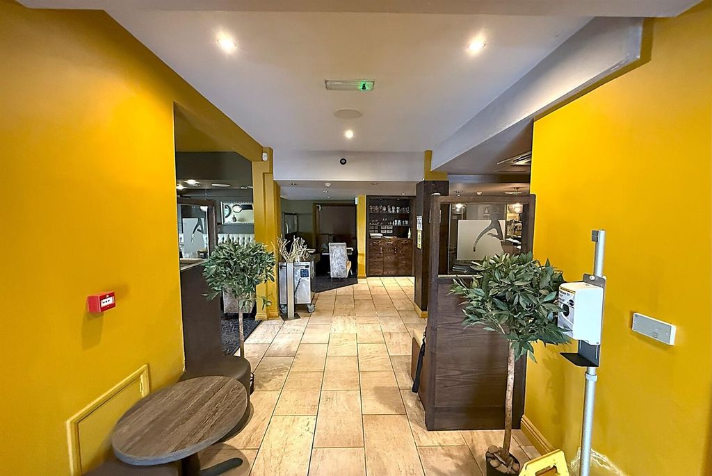 Property photo 2 of 12 Bright Communal Lounge With Dining And Plants...