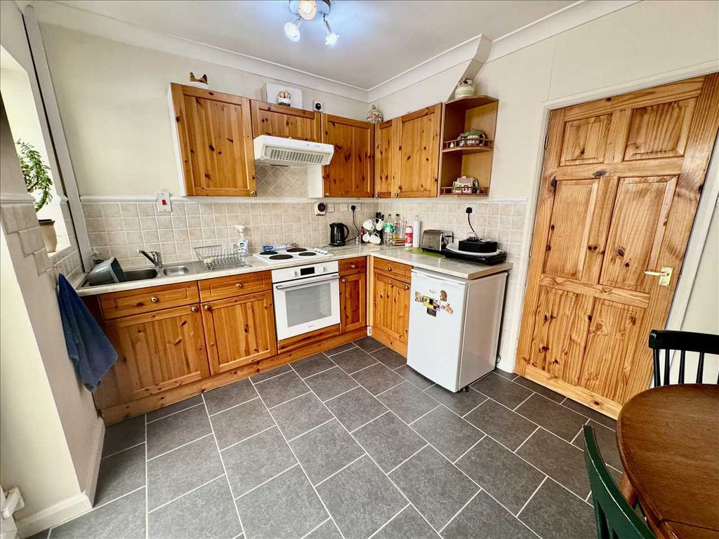 Property photo 3 of 13 Dining Kitchen