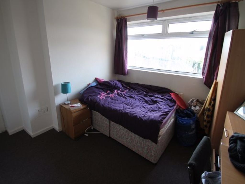 Property photo 3 of 6 A Cozy Single Bedroom Featuring A Bed With Purple ...