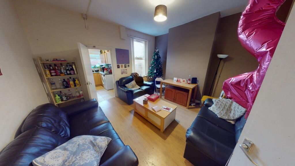 Property photo 3 of 7 A Cozy Living Room Featuring Comfortable Leather S...