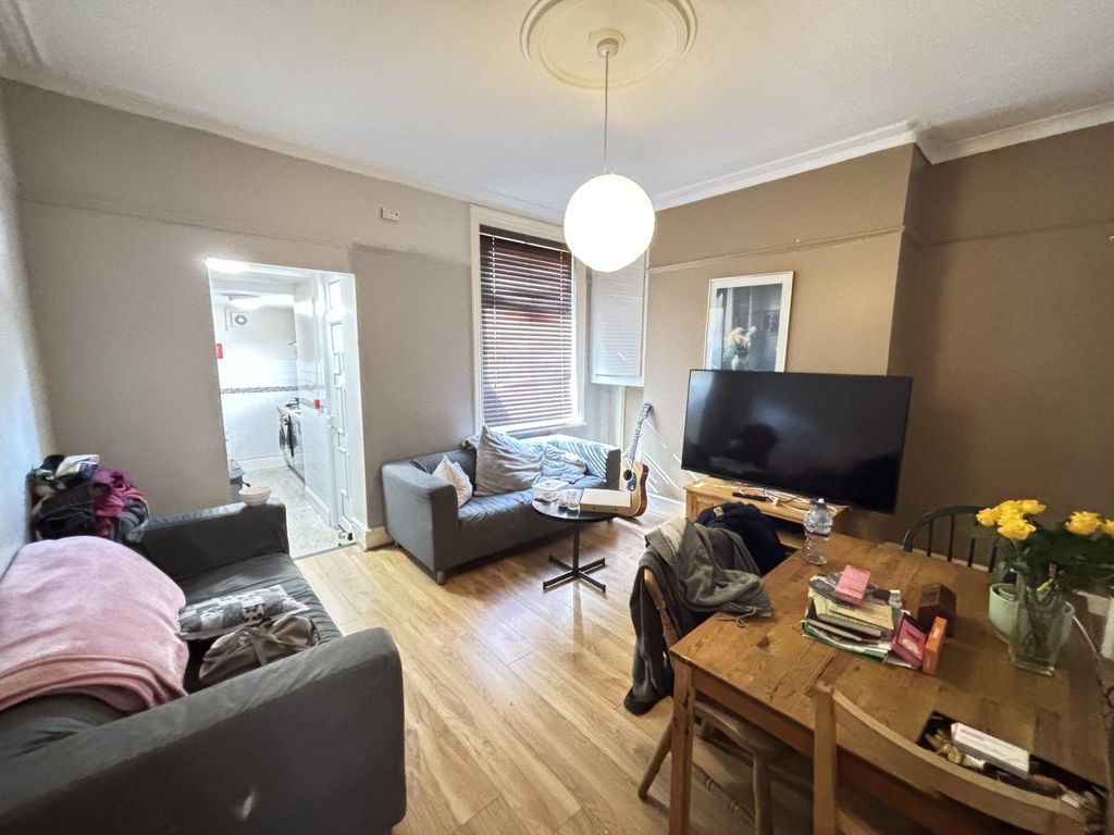 Property photo 3 of 8 A Well-Lit, Modern Living Room With Comfortable Se...