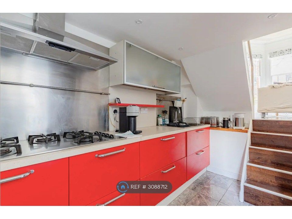 Property photo 3 of 13 Kitchen With Stairs To Living Room