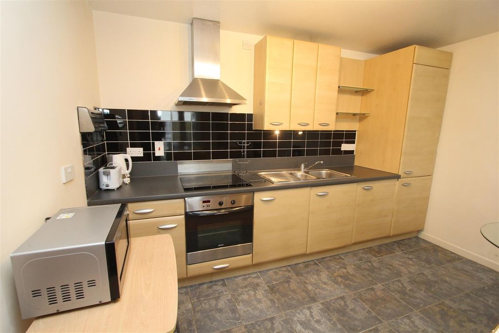 Property photo 2 of 8 Modern Kitchen With Sleek Appliances...