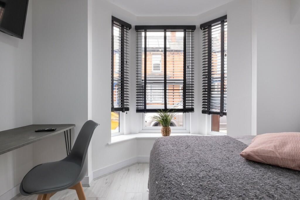 Property photo 3 of 12 A Bright And Inviting Master Bedroom Featuring A l...