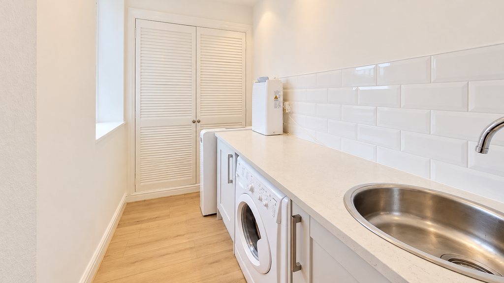 Property photo 3 of 12 Bright Minimalist Laundry Room