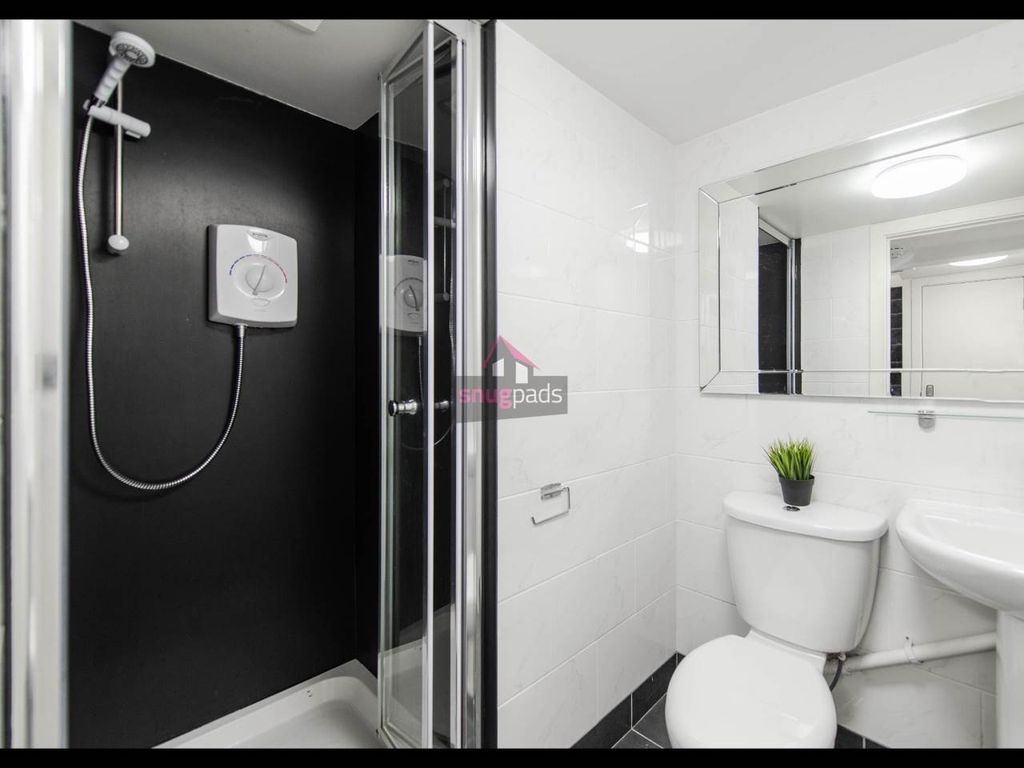 Property photo 2 of 8 A Clean And Modern Bathroom With A Spacious Shower...