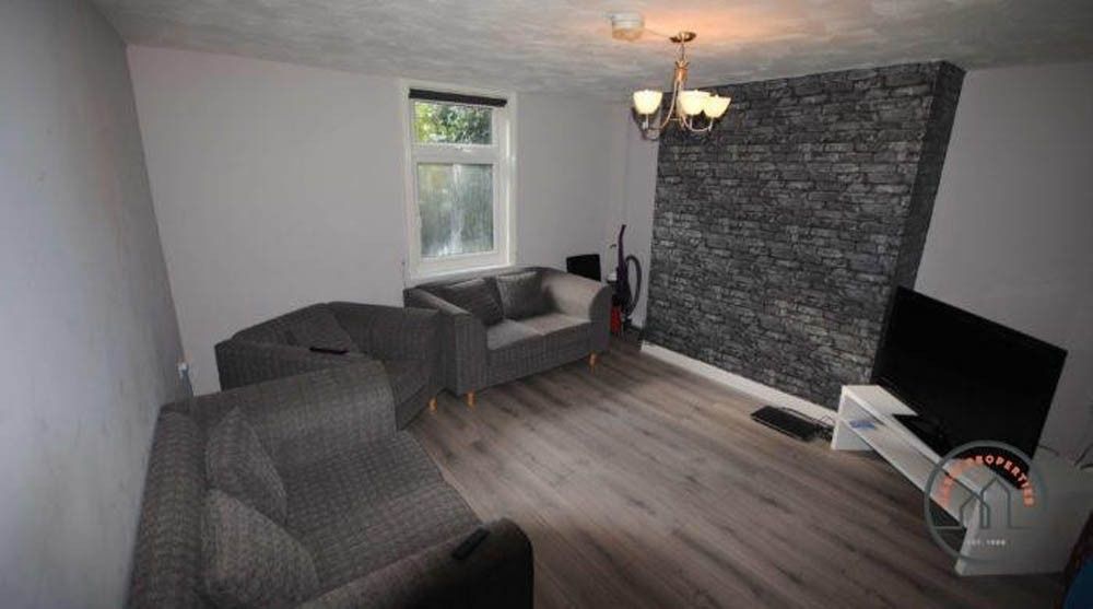 Property photo 2 of 6 A Cozy Living Room Featuring Modern Grey Sofas, A ...