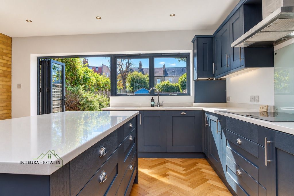 Property photo 3 of 28 Braidwood-Road-Se6-Kitchen-Blue-Cabinets-Island-Garden-View