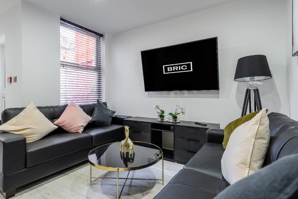 Property photo 3 of 15 Contemporary Living Room Featuring Plush Seating A...