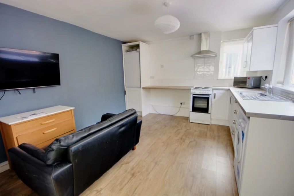 Property photo 3 of 7 A Modern And Inviting Kitchenette With Ample Natur...