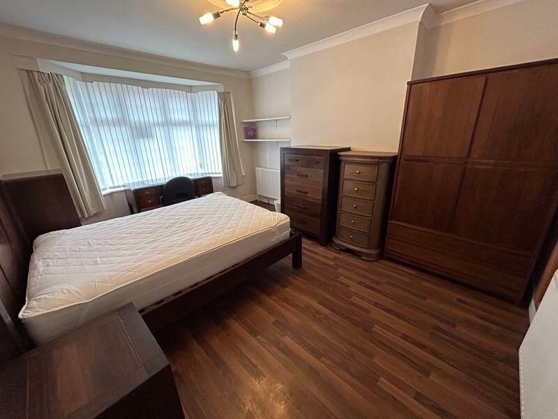 Property photo 2 of 10 A Well-Maintained Bedroom Featuring A Double Bed, ...