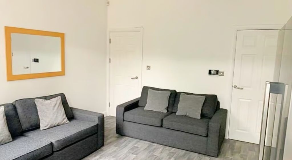 Property photo 1 of 9 A Cozy Living Room Featuring Modern Furnishings, A...