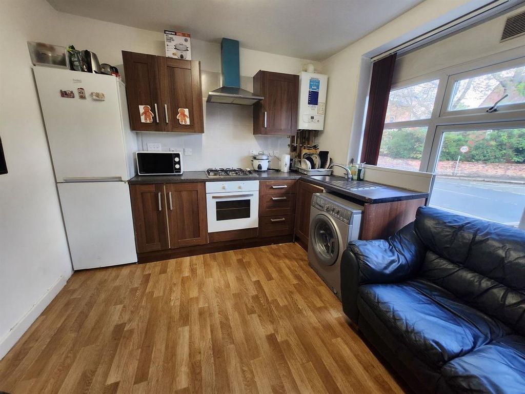 Property photo 2 of 12 A Welcoming Living Room Featuring A Comfortable So...