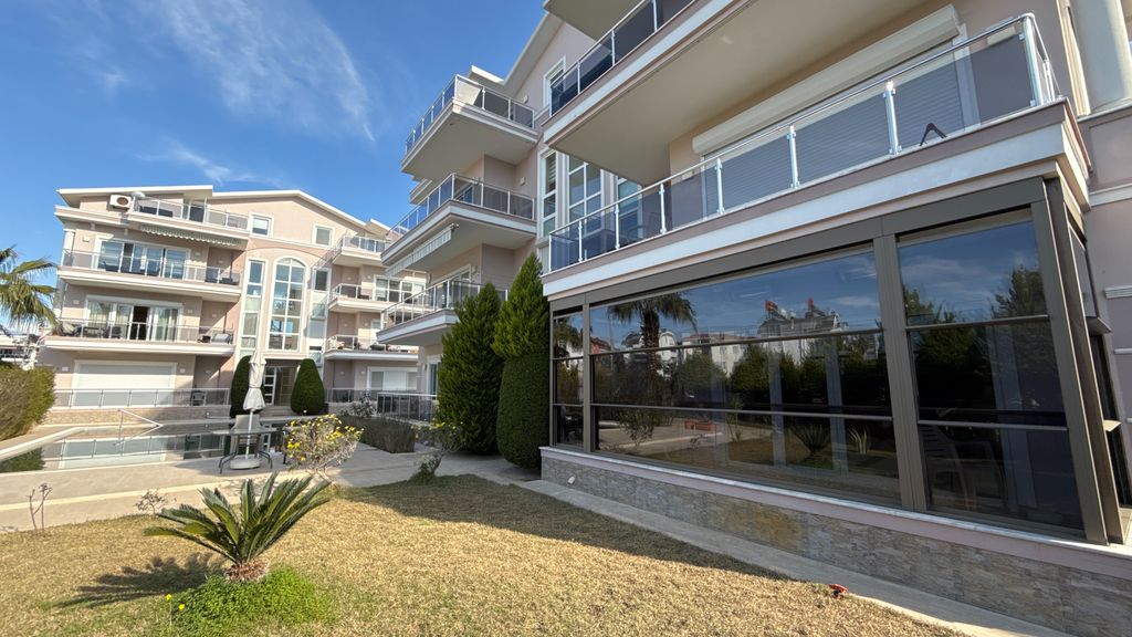 Property photo 3 of 21 A Ready To Move Apartment In Antalya For Sale - Ground-Floor Apartment With Balcony Glass System For Use All Year Round