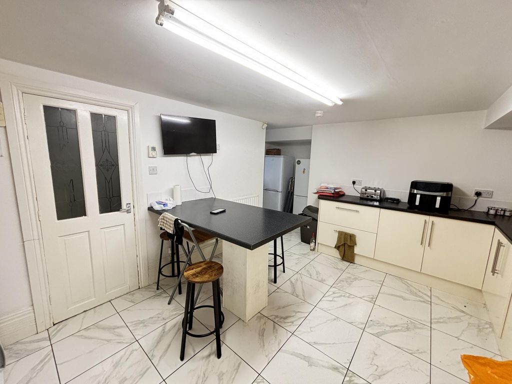 Property photo 1 of 6 A Bright, Spacious Living Room Featuring A Large W...