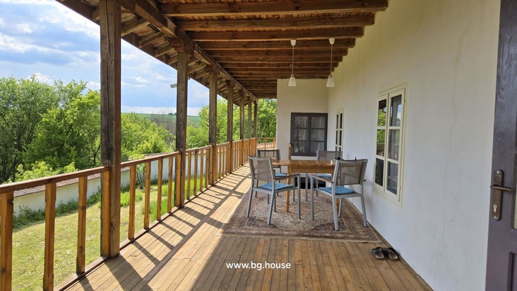 Property photo 3 of 92 Outdoor Seating On The Veranda With A Wooden Table And Chairs, Surrounded By Trees And Open Landscape