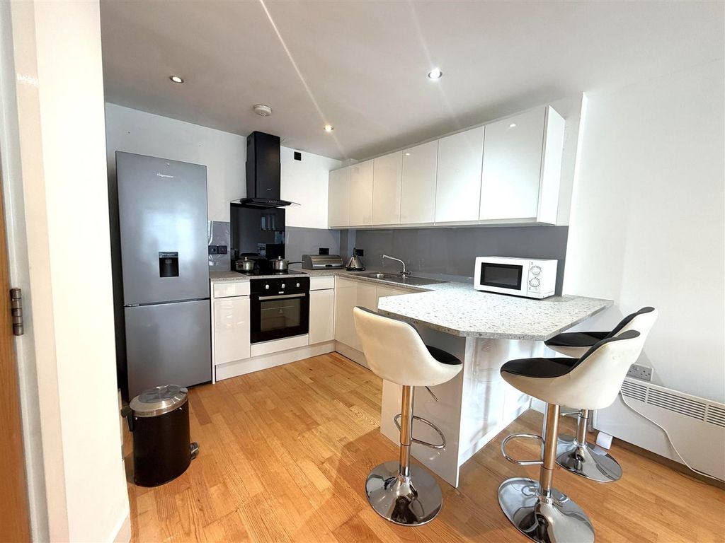Property photo 2 of 9 Modern Kitchen With Breakfast Bar And Sleek Units...