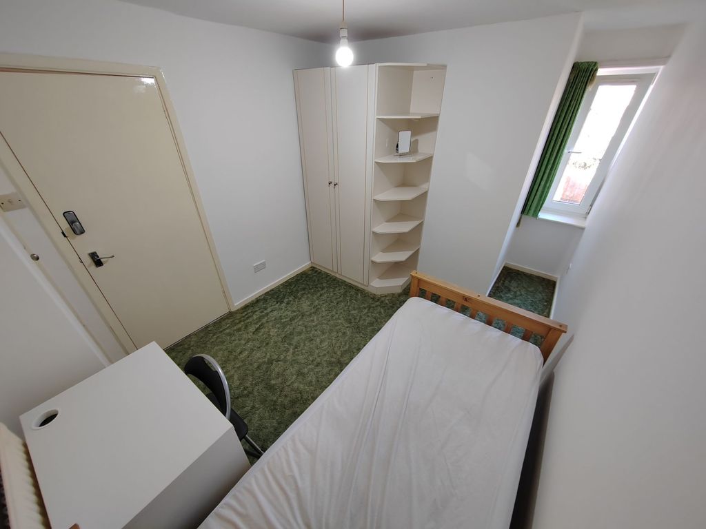 Property photo 1 of 7 A Cozy Single Bedroom With A Simple Bed Frame, A W...