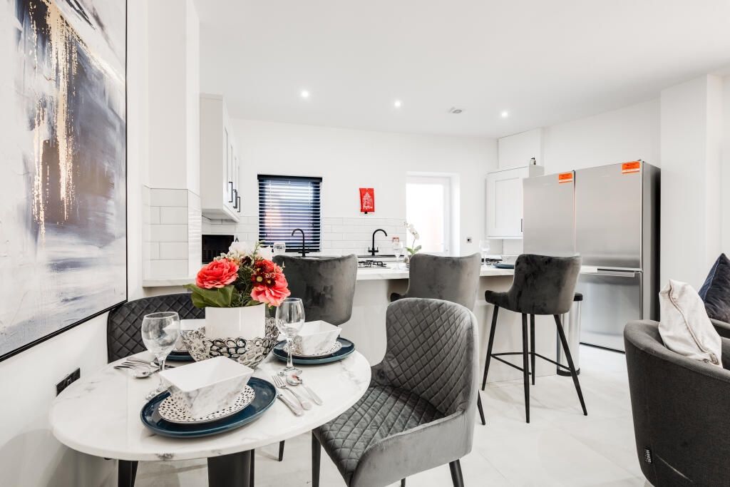 Property photo 1 of 13 A Spacious And Modern Living Room With Large Windo...