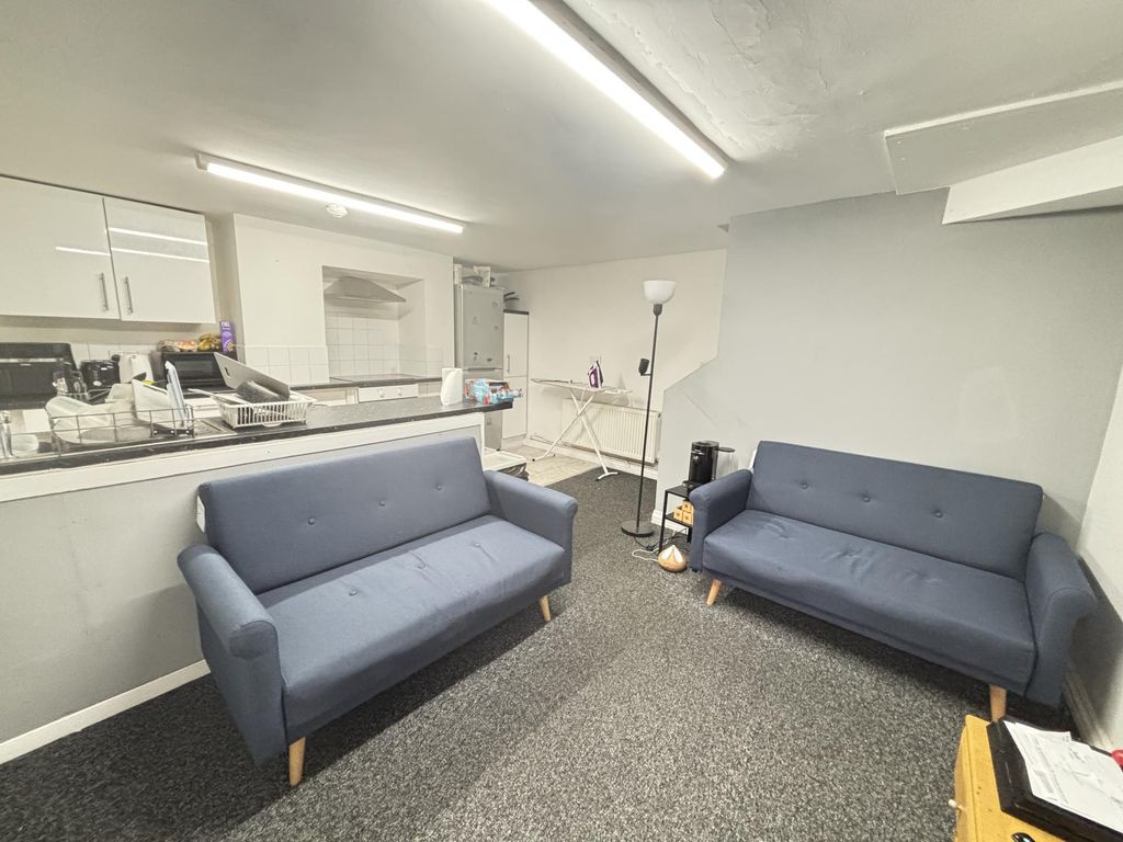 Property photo 1 of 17 A Spacious And Modern Living Room Featuring Two St...