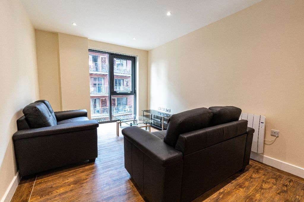 Property photo 3 of 10 Bright And Modern Living Room Featuring Comfortabl...
